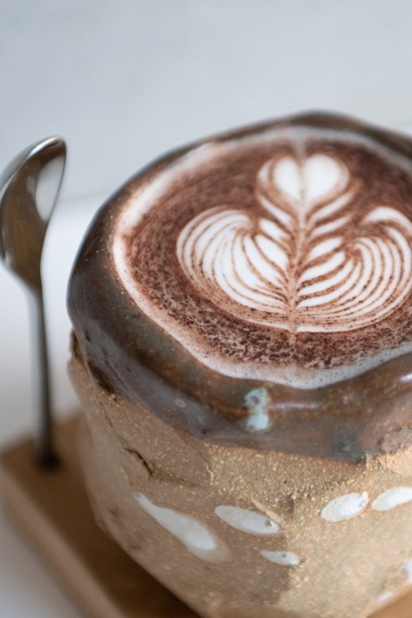 Black sesame latte with spoon stand.