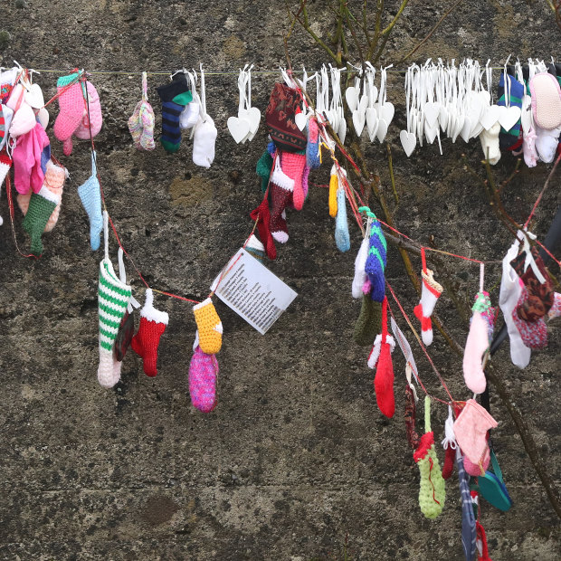 Children’s socks line a grotto on an unmarked mass grave at the site of the Tuam Mother and Baby Home, which closed in 1961.