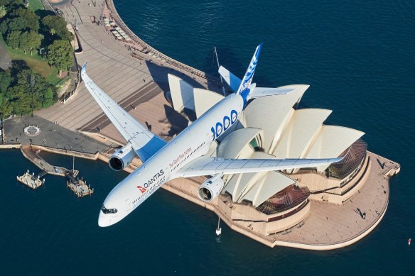 SYDNEY, AUSTRALIA - MAY 02: An Airbus A350-1000 flight test aircraft flies over the Sydney Opera House to mark a major fleet announcement by Australian airline Qantas on May 02, 2022 in Sydney, Australia. Twelve Airbus A350-1000's will be ordered to operate non-stop "Project Sunrise" flights from Australia's east coast to New York, London and other key destinations. The aircraft will feature market-leading passenger comfort in each travel class with services to start by the end of 2025. (Photo by James D. Morgan/Getty Images for Airbus/Qantas)