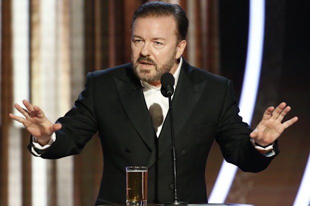 BEVERLY HILLS, CALIFORNIA - JANUARY 05: In this handout photo provided by NBCUniversal Media, LLC,  host Ricky Gervais speaks onstage during the 77th Annual Golden Globe Awards at The Beverly Hilton Hotel on January 5, 2020 in Beverly Hills, California. (Photo by Paul Drinkwater/NBCUniversal Media, LLC via Getty Images)