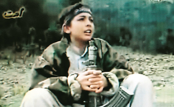 A photo taken from a film of Hamza bin Laden during terrorist training in the Afghanistan-Pakistan border area. His age at the time is unknown.