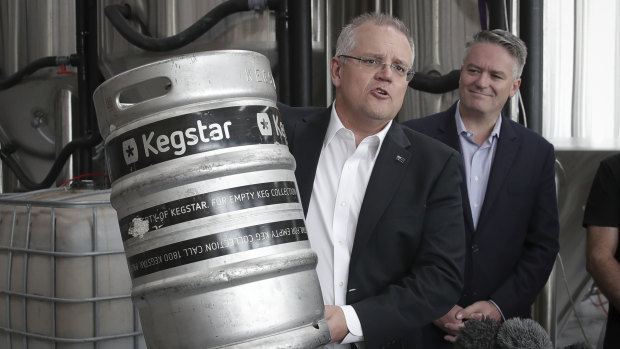 Treasurer Scott Morrison announces a reduction in the tax burden on craft beer at a Canberra brewery on Friday. 