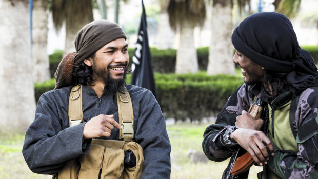 Neil Prakash, left, from a jihadist propaganda video in about 2015. Prakash, an Australian, is accused of fighting for Islamic State in Syria and being a key recruiter of Australians for the group.