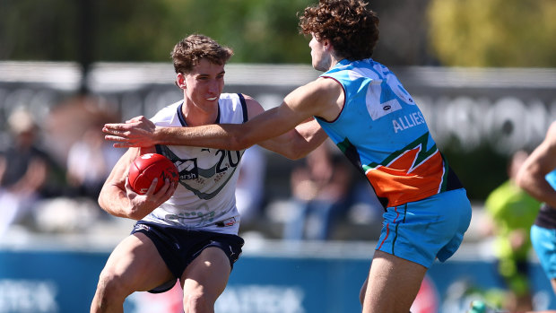 Jack Whitlock looks to evade a tackle during the national championships.