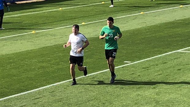 Good to go: Tom Rogic trains with a bandage on his broken hand in Dubai on Tuesday.