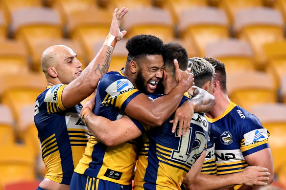 Waqa Blake celebrates his try for the Eels against the Broncos at Suncorp Stadium on Thursday night.