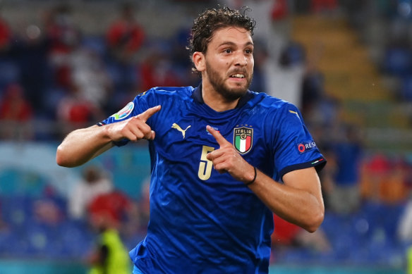 Manuel Locatelli celebrates the first of his two goals for Italy against Switzerland.