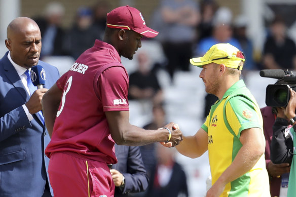 Aaron Finch and Jason Holder in 2019.