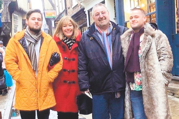 Victim Gus Kennedy (right) with his twin brother and parents in the UK in 2019.