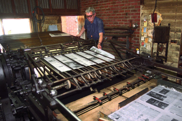 The pages roll off an 1894 Miehle printing press at The Bridge's office in 2003.