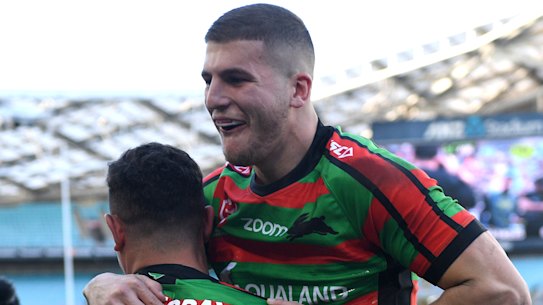 Try time: Dane Gagai and Adam Doueihi enjoy a four-pointer in the corner.