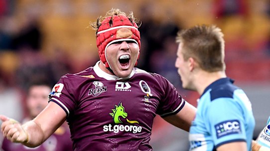 Harry Wilson of the Reds celebrates scoring a try against the Waratahs.