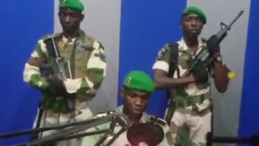A soldier who identified himself as Lieutenant Obiang Ondo Kelly, commander of the Republican Guard, reads a statement on state television broadcast from Libreville, Gabon, saying the military has seized control of the government. 