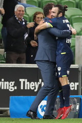 Nicholas D’Agostino celebrates a goal with Popovic on the Victory sideline.
