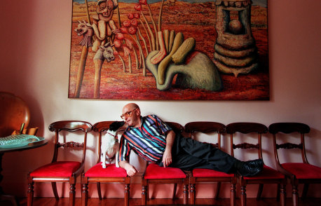 The reclining judge in 1999 with dog Madge and one of the many artworks in his personal collection.