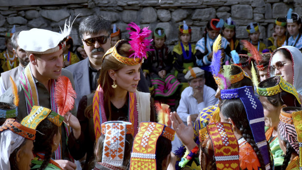 Prince William and Catherine chat with women of the Kalash community during their visit to Bumburate Valley, an area of Pakistan's northern Chitral district where glaciers are melting at a fast pace.