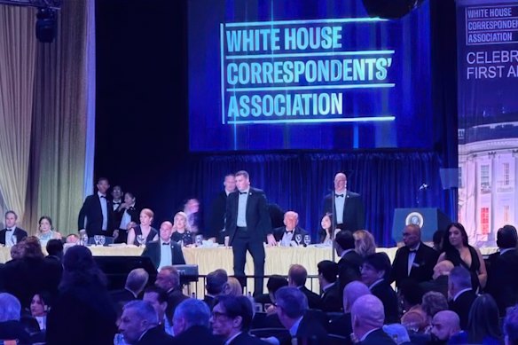 US Secret Service agents rush to the stage where US President Donald Trump was seated at the White House Correspondents’ Dinner.
