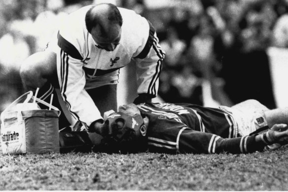 Ron Gibbs is attended to by a trainer after being knocked out playing for Manly in 1987.