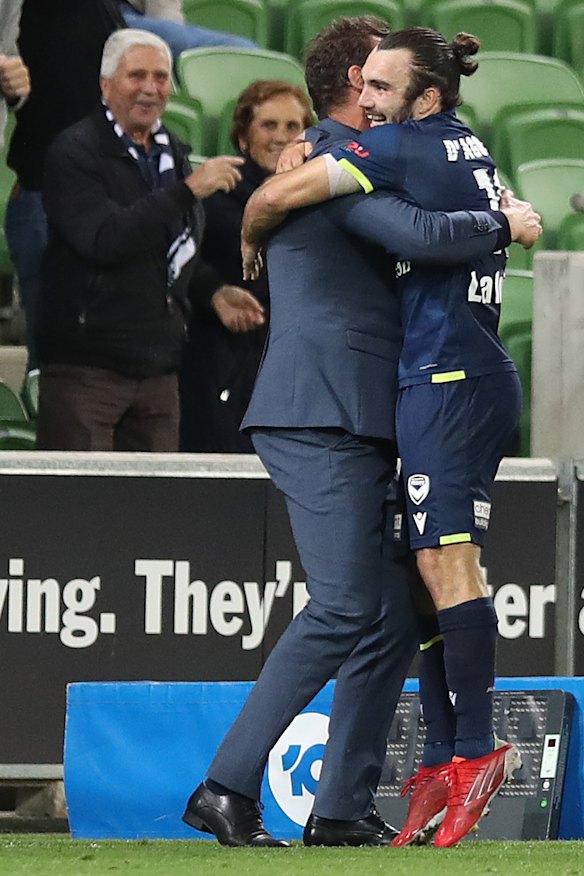 Nicholas D’Agostino celebrates a goal with Popovic on the Victory sideline.