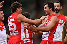 Logan McDonald celebrates with Charlie Curnow.