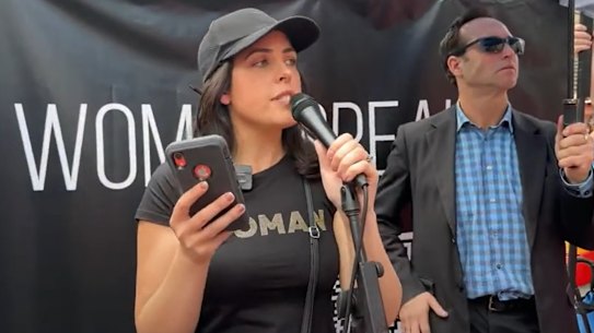 Moira Deeming speaking at an anti-trans rights rally at Parliament House on Saturday.