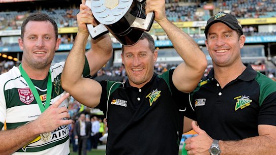 Chris, Ben and Shane Walker celebrate the Jets’ victory in the 2015 state championship final.