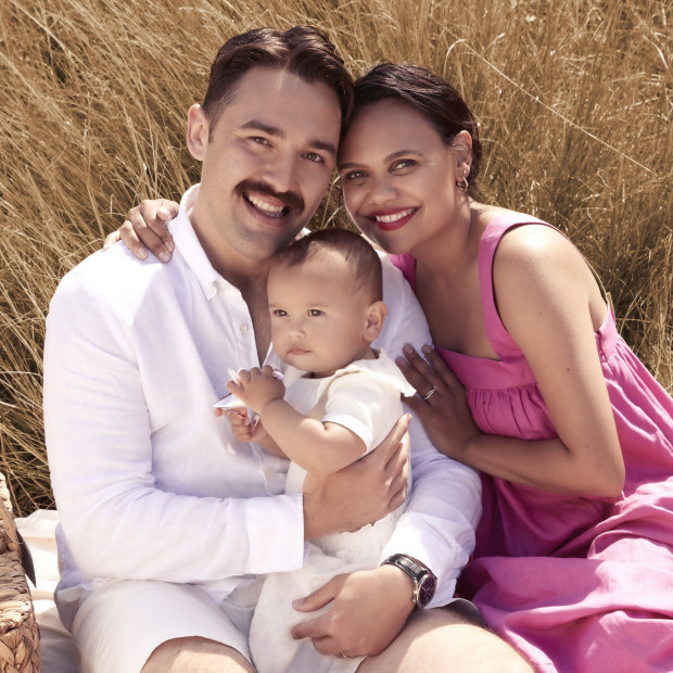 Miranda with husband James Colley and daughter Grace. Miranda wears Oroton “Bow Detail” dress, $549, and Alinka “Cloud” diamond earring, $2900 (throughout). James wears Venroy shirt, $140, and shorts, $160. Grace wears Country Road bodysuit, $35. Basket by Annabel Trends, $70.