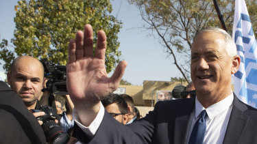 Benny Gantz, leader of the Blue and White party, greets supporters after casting his vote in a polling station in Rosh Ha'ayin, Israel.