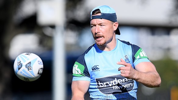 Going to great lengths: Damien Cook.