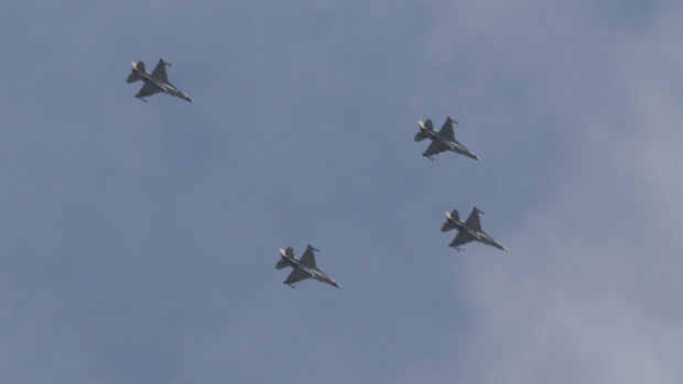 Israeli planes fly over Ashkelon, near the border with Gaza, on Sunday.