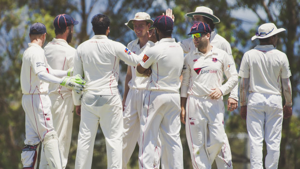 Eastlake players celebrate a wicket against Tuggeranong Valley on Sunday.