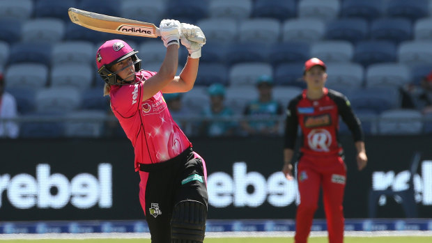 Swinging for the fences: Ellyse Perry in action for the Sixers in their clash against the Renegades at GMHBA Stadium in Geelong.