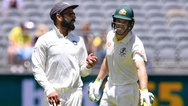 Indian captain Virat Kohli and Australian counterpart Tim Paine exchange words.