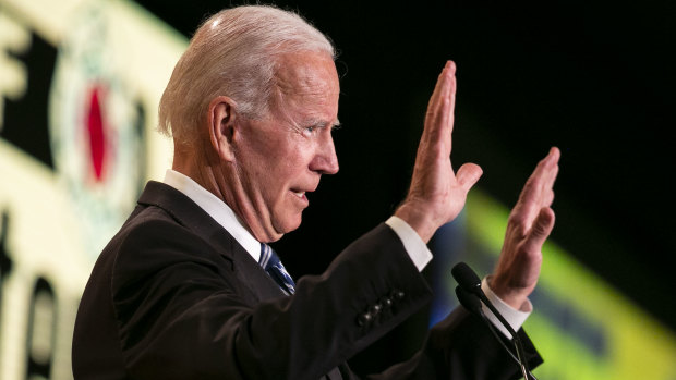 Biden gestures while speaking during the International Association of Fire Fighters (IAFF) Legislative Conference in Washington.