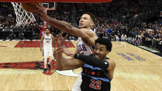 Ben Simmons fights for the ball with Chicago's Otto Porter jnr.