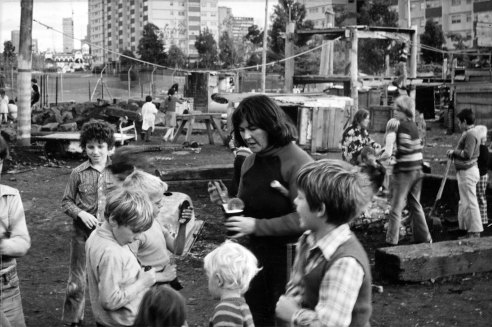 Joan Healey, author and founder of The Cubbies, surrounded by children who gravitated to the place.