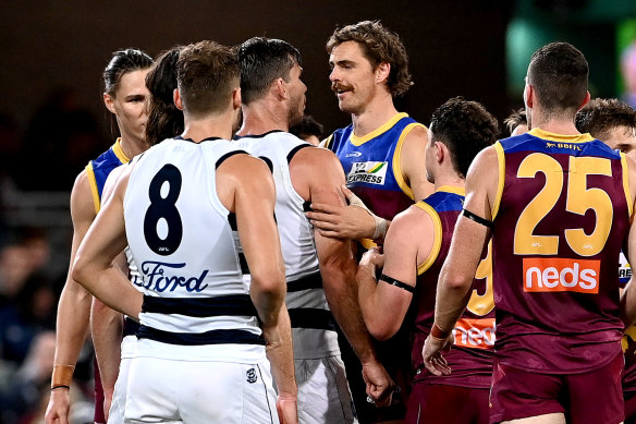 Geelong’s Tom Hawkins tangles with opposing spearhead, Joe Daniher.