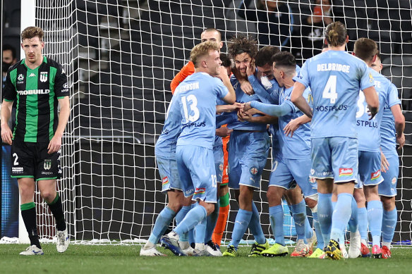 City celebrate their second goal.