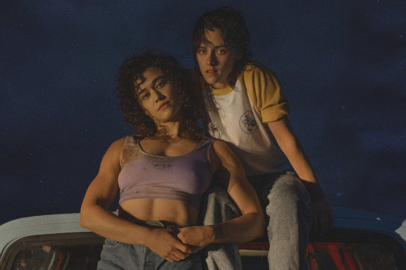 Katy O’Brian (left), and Kristen Stewart as lovers Jackie and Lou in the psychological horror Love Lies Bleeding.