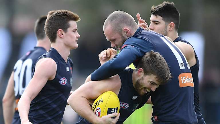 Jack Viney and Max Gawn get close and personal.