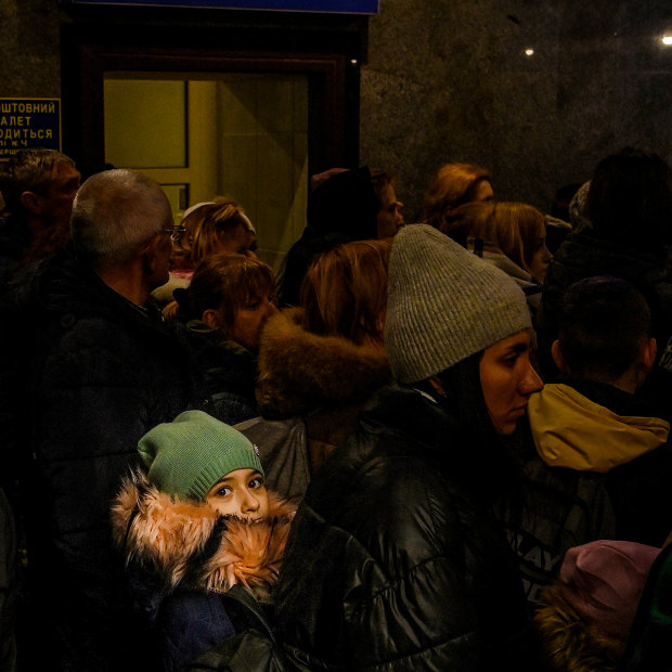 Crowds inside Lviv railway station queue to catch the train to Poland.