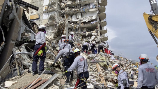 Search-and-rescue teams sift through the rubble of the collapsed apartment building in Miami on Friday, local time.