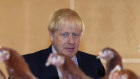 Boris Johnson inspects the chickens during his visit to rally support for his farming plans post-Brexit.