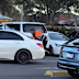 A man has been filmed holding onto the boot of a moving Mercedes during a dispute in a Melbourne shopping centre car park.