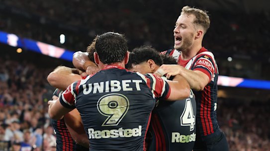 The Roosters celebrate a try for Mark Nawaqanitawase.