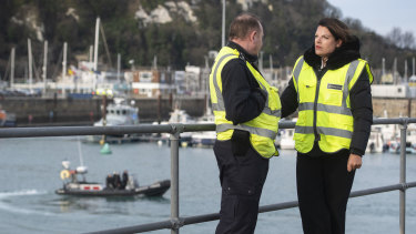 Britain's Immigration Minister Caroline Nokes talks to a Border Force officer in Dover on the weekend.