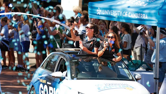 Keely Froling and Leilani Mitchell lapping up a tickertape parade.