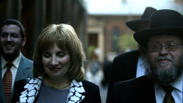 Pnina Feldman leaving a separate court case with her husband Rabbi Pinchus Feldman that also featured her brother Joseph Gutnick as a defendant. 
