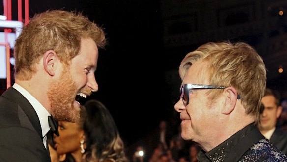 Prince Harry greets Elton John after the Royal Variety Performance at the Albert Hall in London in 2015.