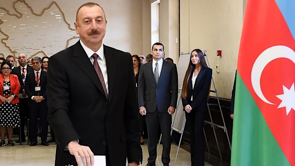 Azerbaijan President Ilham Aliyev casts his ballot at a polling station on April 11. 